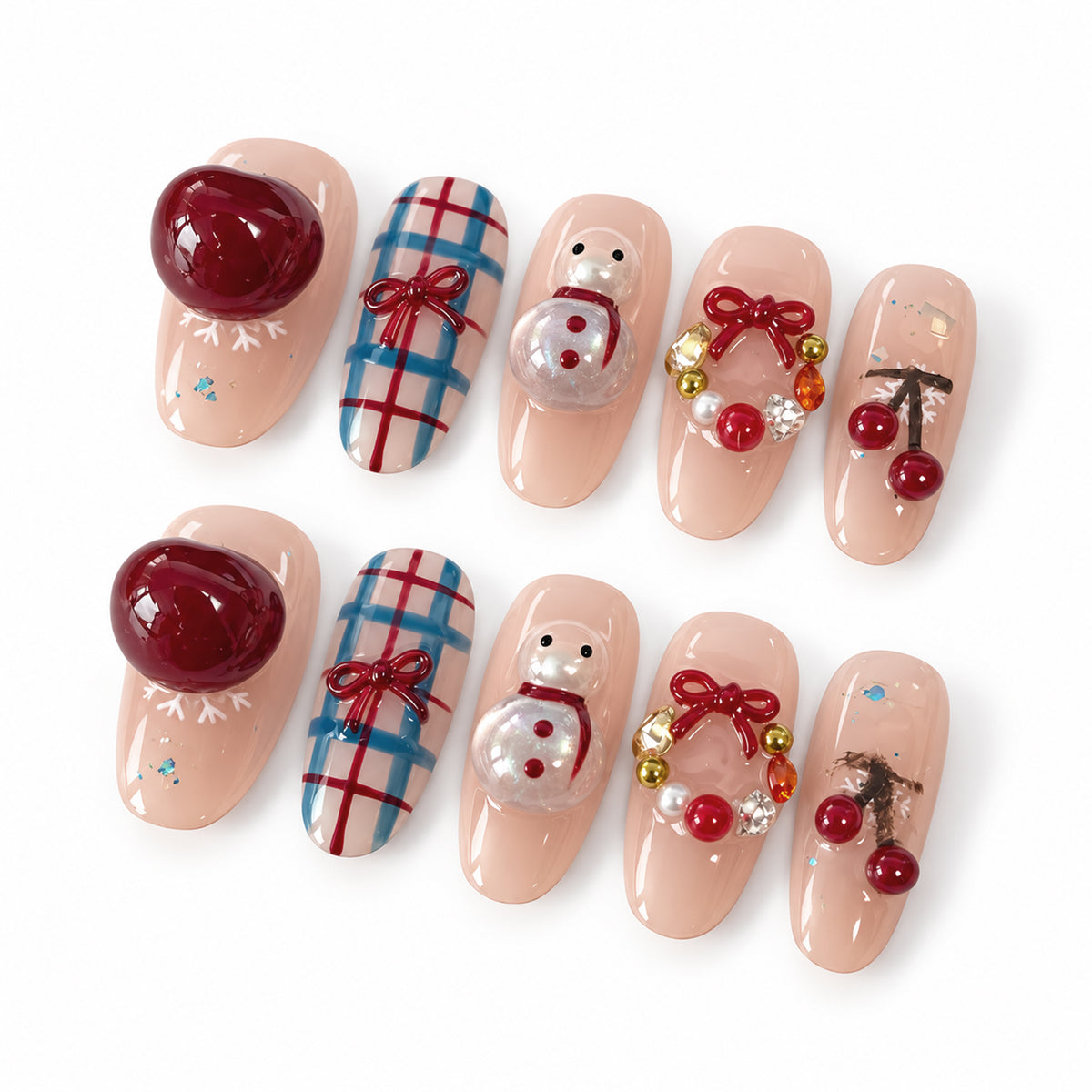 Ten glossy nude pink rounded nail tips with burgundy cherries, snowmen, blue-red plaid and bow-topped wreaths on a white background.